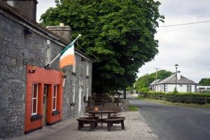 Wooden table and benches outside of a local pub in the Irish countryside. County Mayo.