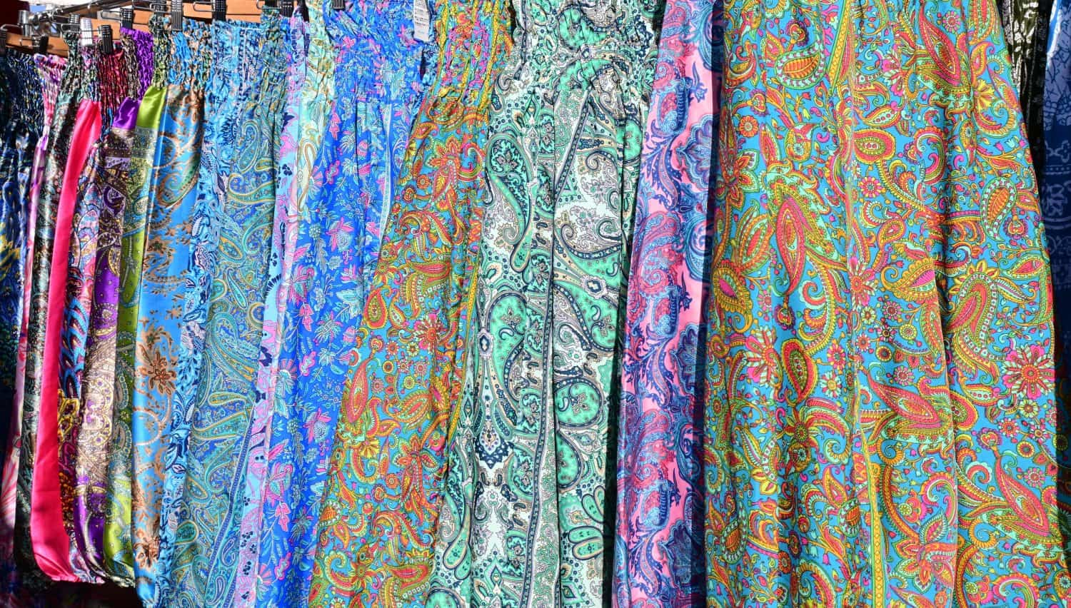 Lots of long skirts, light, fabric, paisley pattern, colorful, pattern