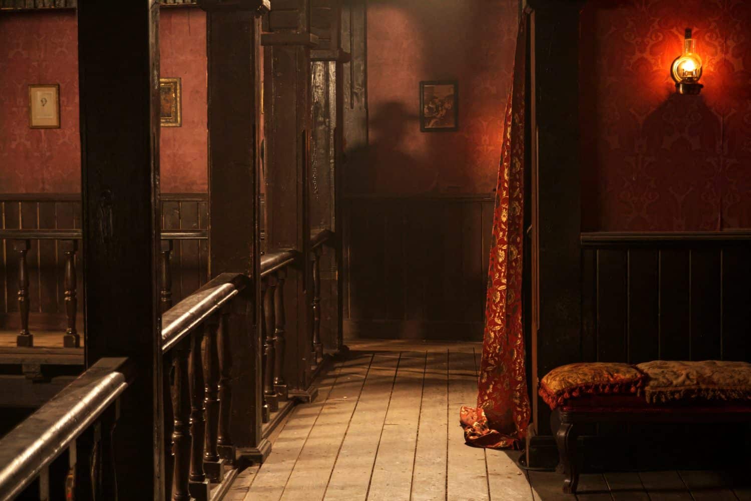 suspense scene of a man hiding behind a pillar in a saloon