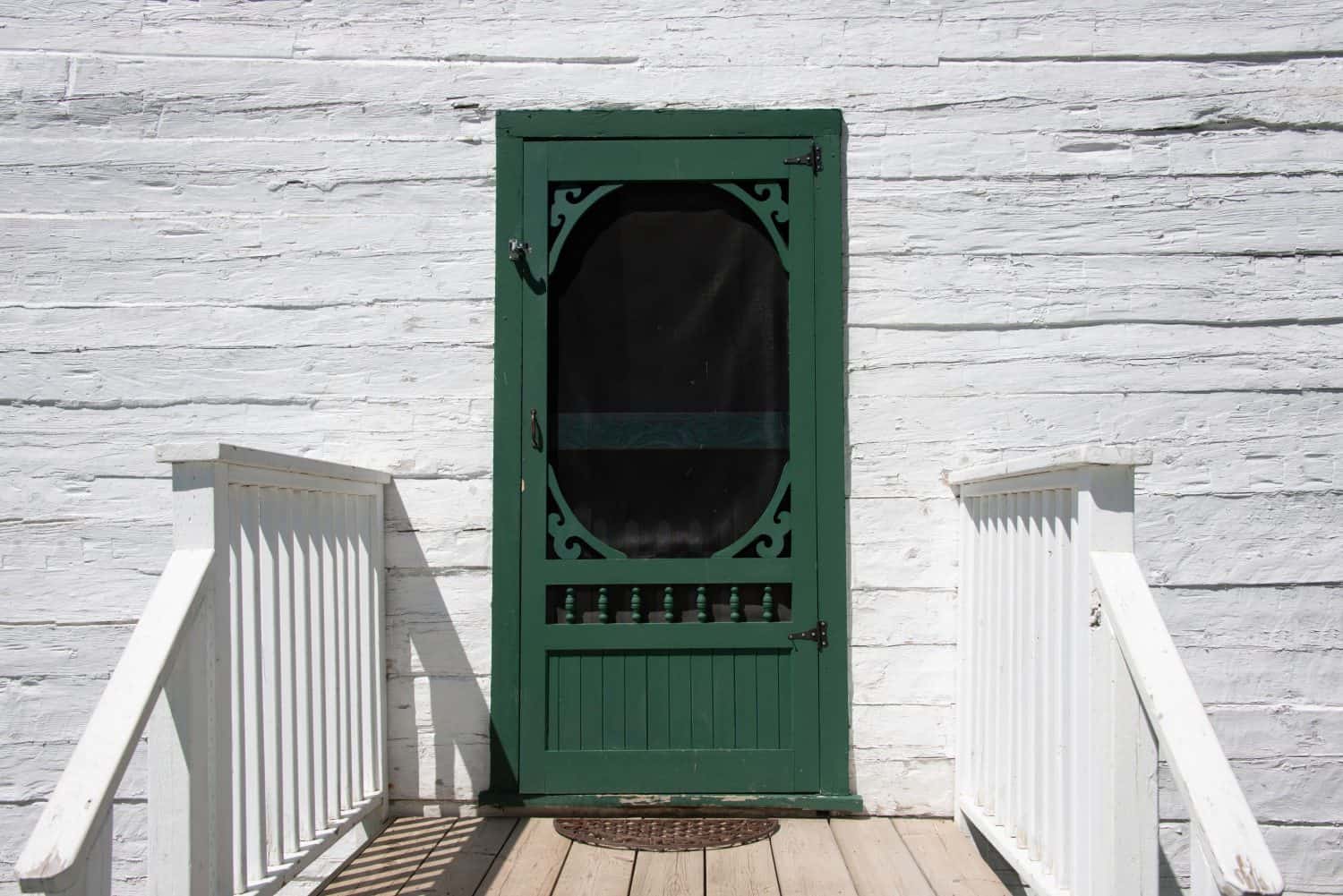 Green screen door to an vintage house