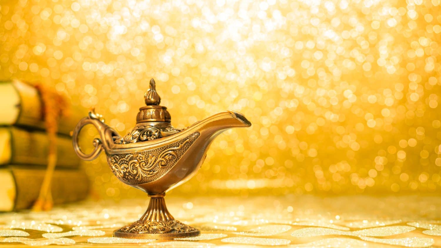 golden magic aladdin's lamp on bright and blur background