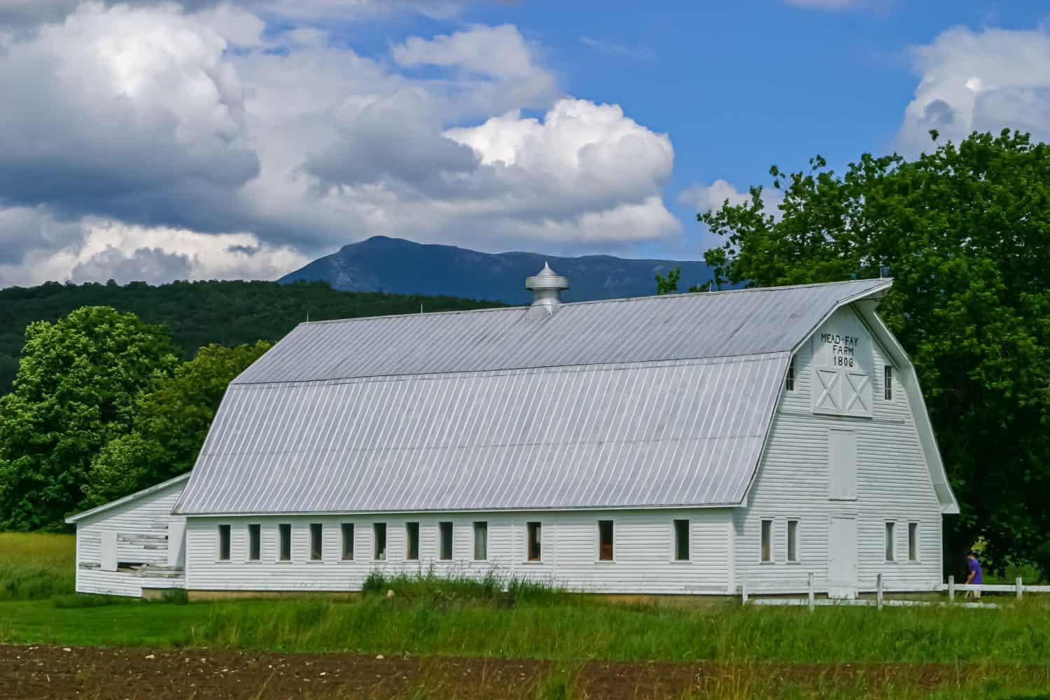 Vermont barn with Mount Mansfield in background in Underhill, Vermont.