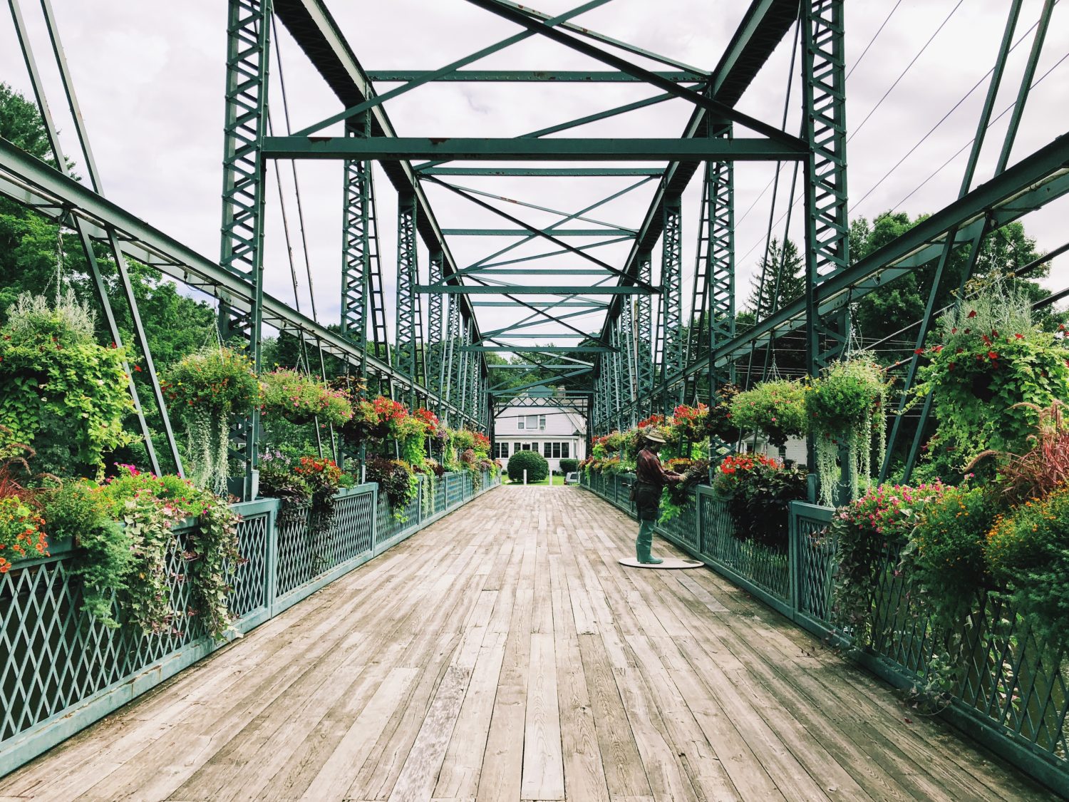 Old Drake Hill Flower Bridge is a bridge in Simsbury, Connecticut,United States. Originally carrying Drake Hill Road over the Farmington River. It is one of three surviving Parker truss bridges.