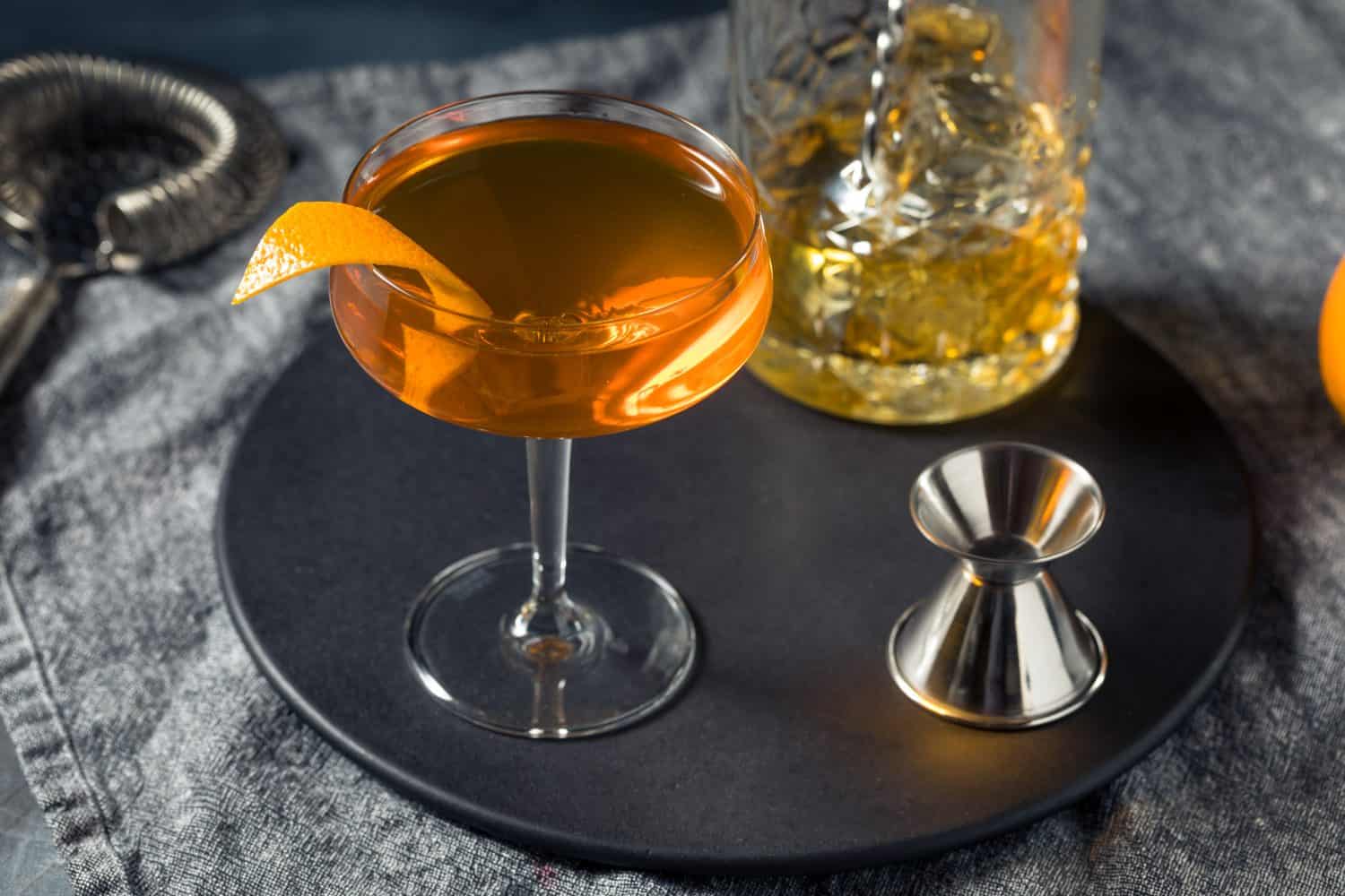 Cold Refreshing Boozy Irish Blonde Whiskey Cocktail with Orange and Sherry