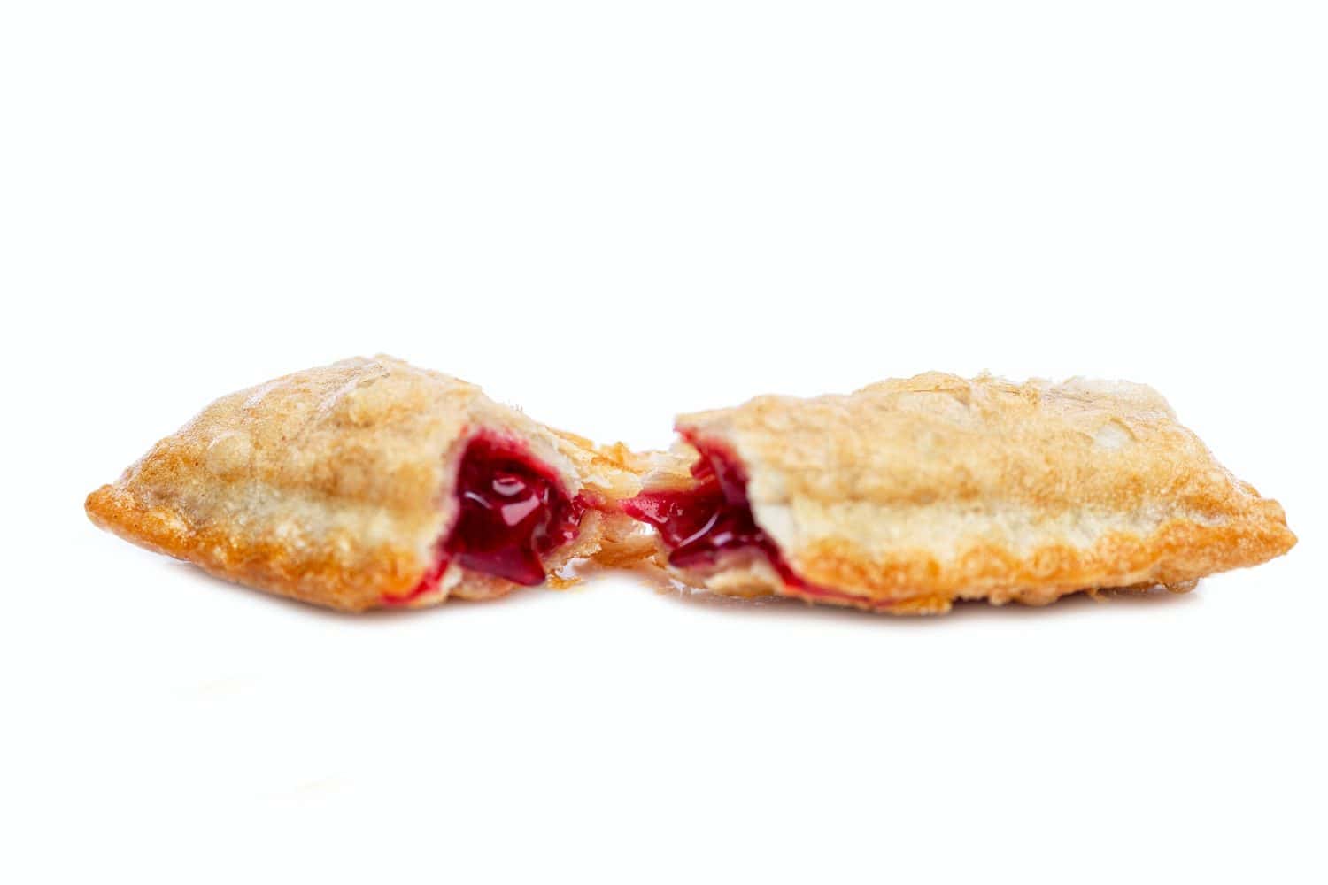 Fried sweet pie of a popular fast food restaurant chain. Delicious garbage food. Isolated on a white background. Selective focus. Close-up.