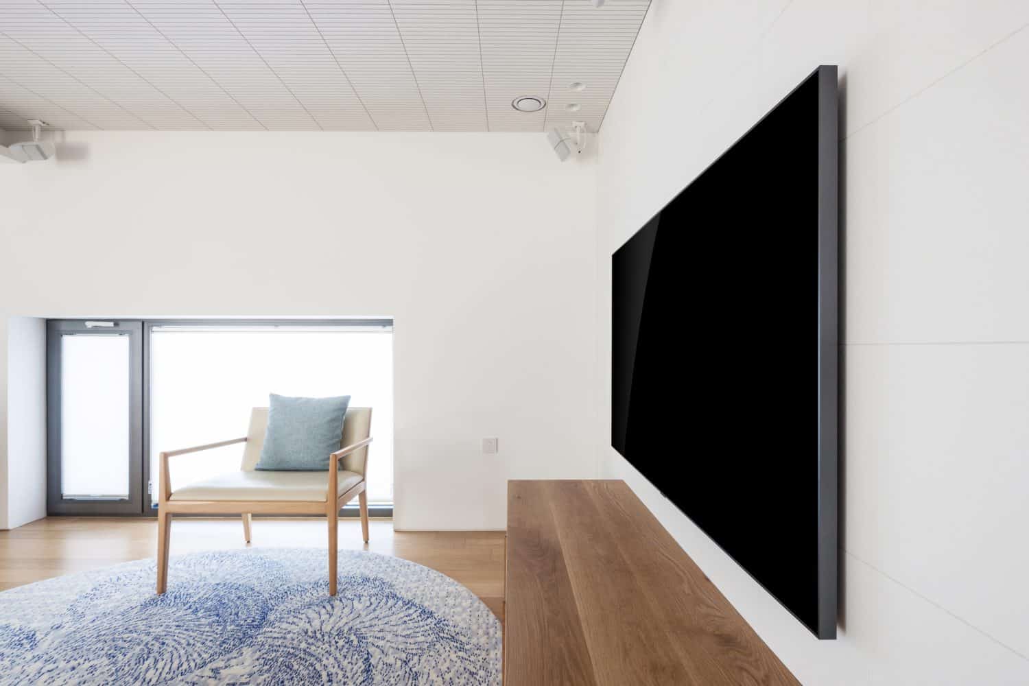 uhd 65 inch tv side view in a white indoor
