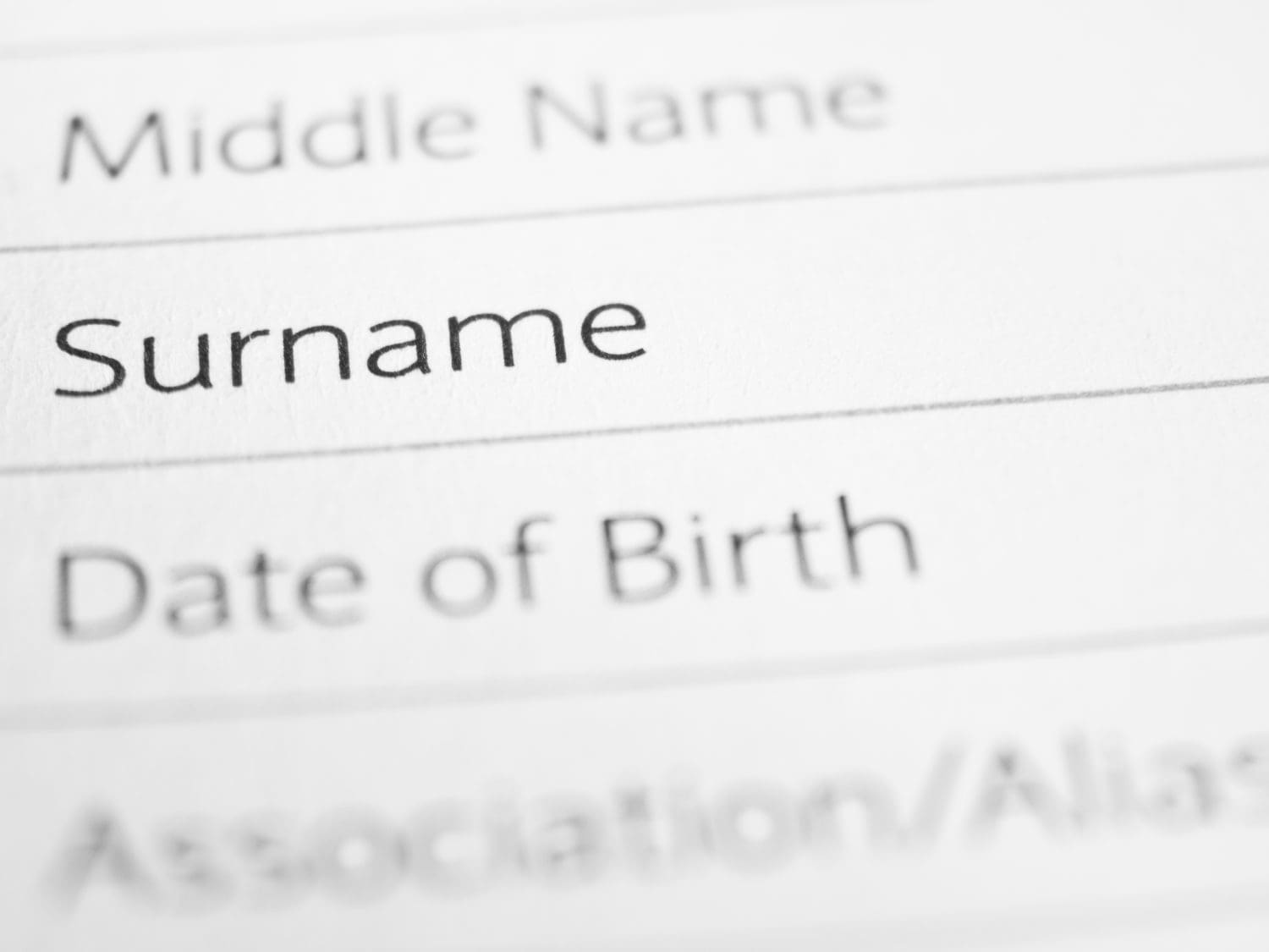 SURNAME close up on a printed form