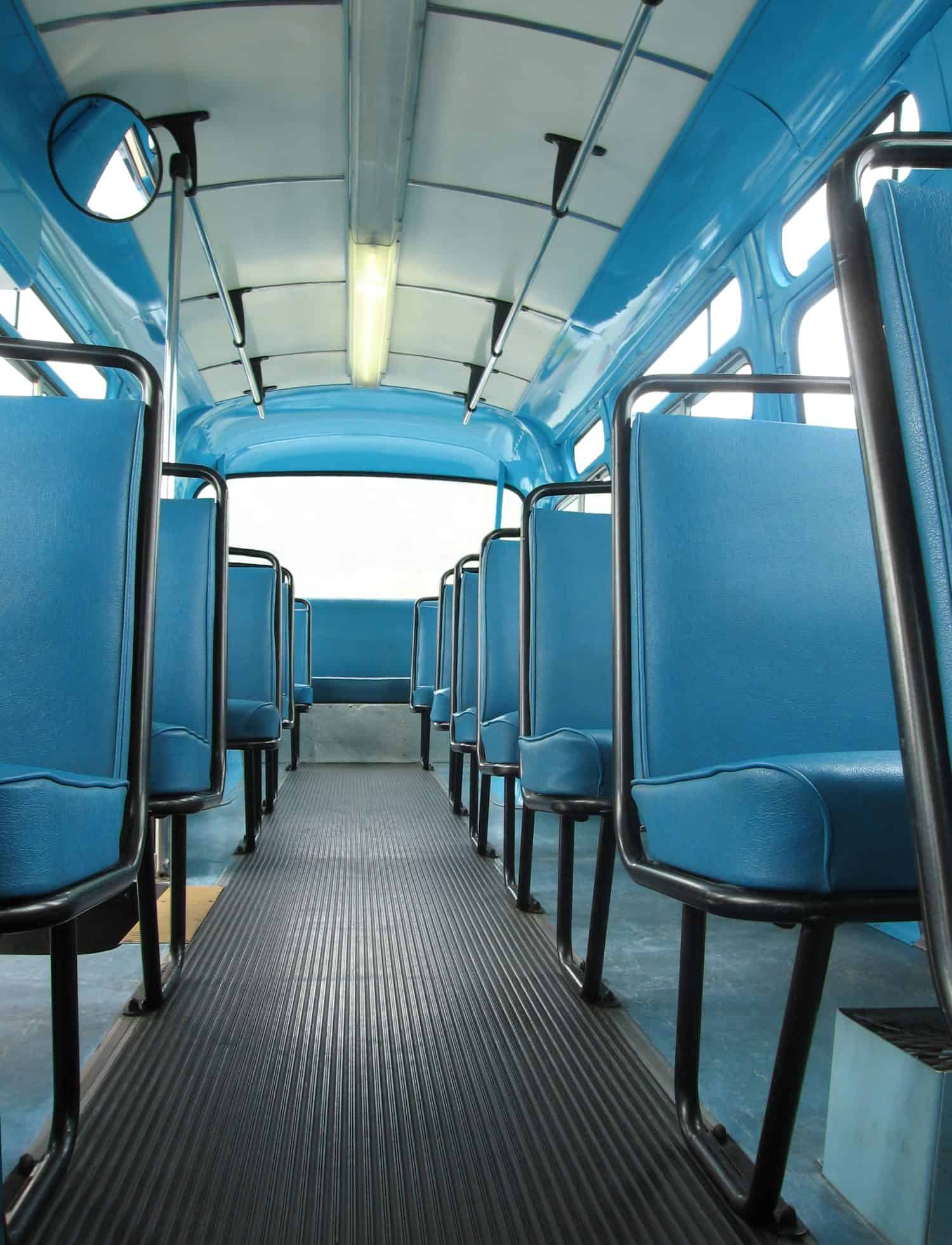 A view down the aisle of a restored 1959 city transit bus. Very much like the bus Rosa Parks made her stand in.