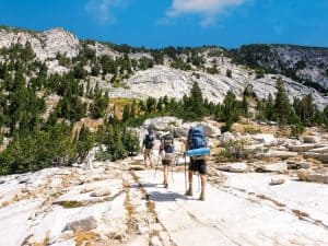 A group of backpackers hiking the John Muir Trail in the Sierra Nevada Mountains of California