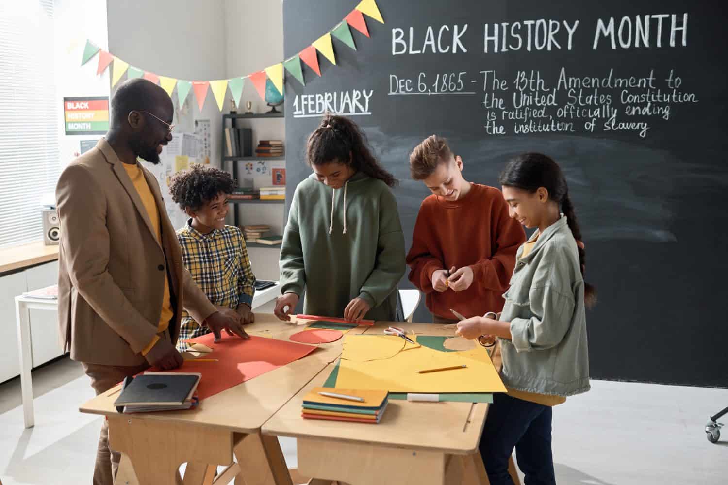 Children with teacher preparing for Black History Month