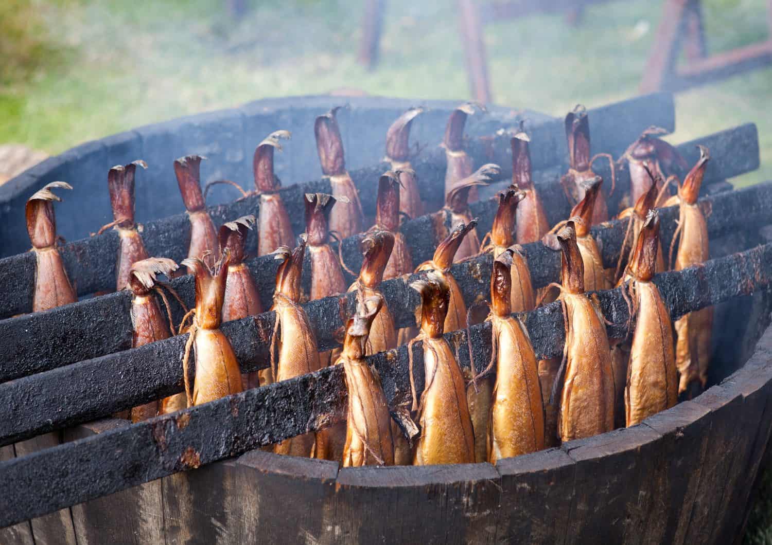 Traditional Scottish smoked fish cooking in wooden barrel