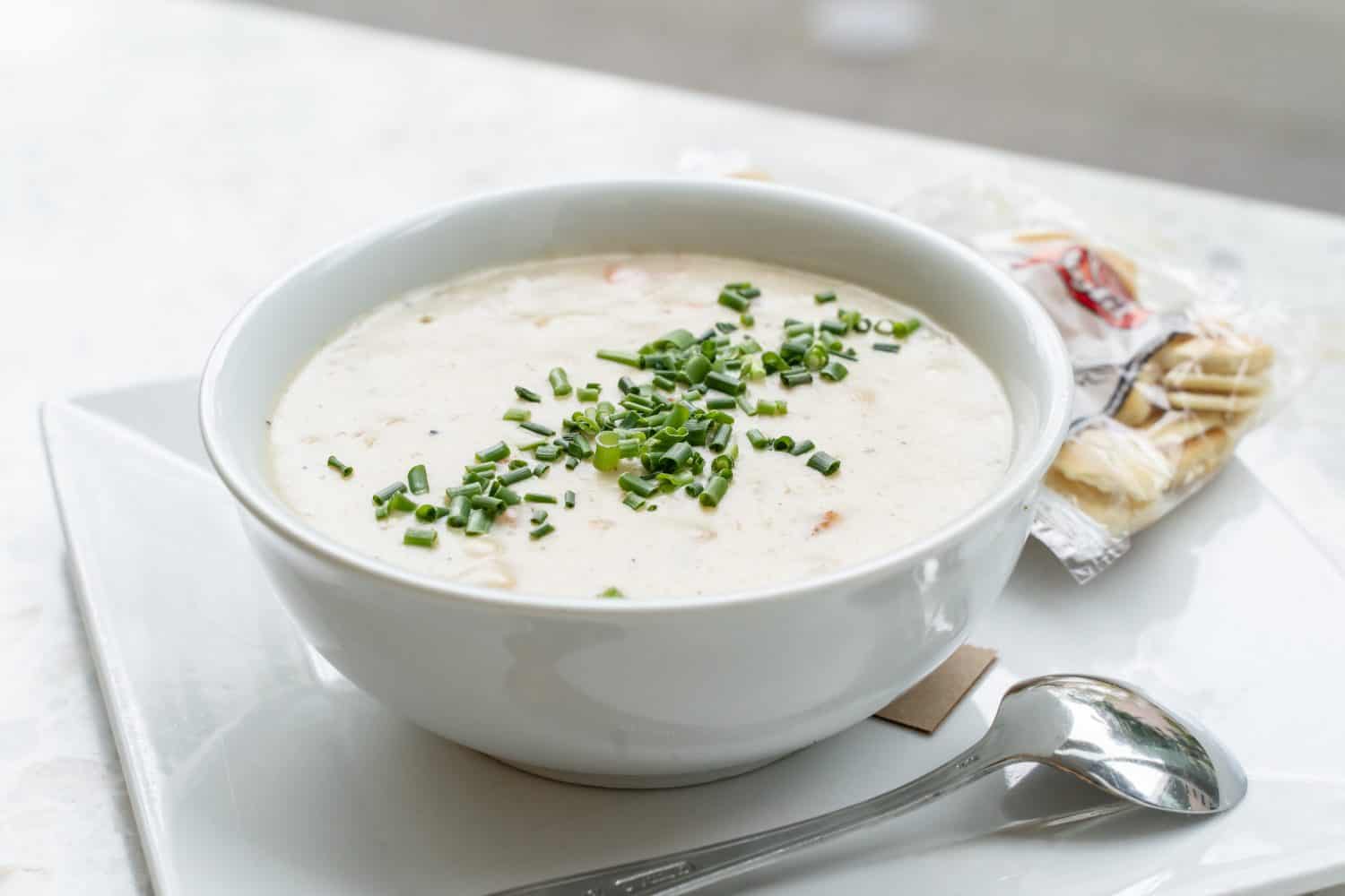Stock photo of a creamy and hot clam chowder served in a restaurant on a cold day.