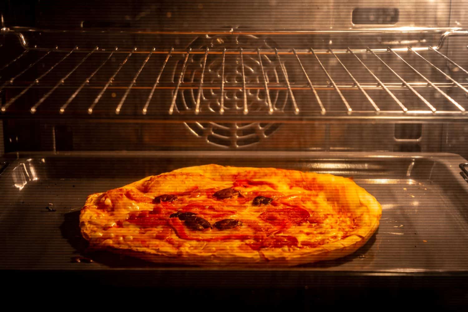 Frozen pizza reheated in the electric oven