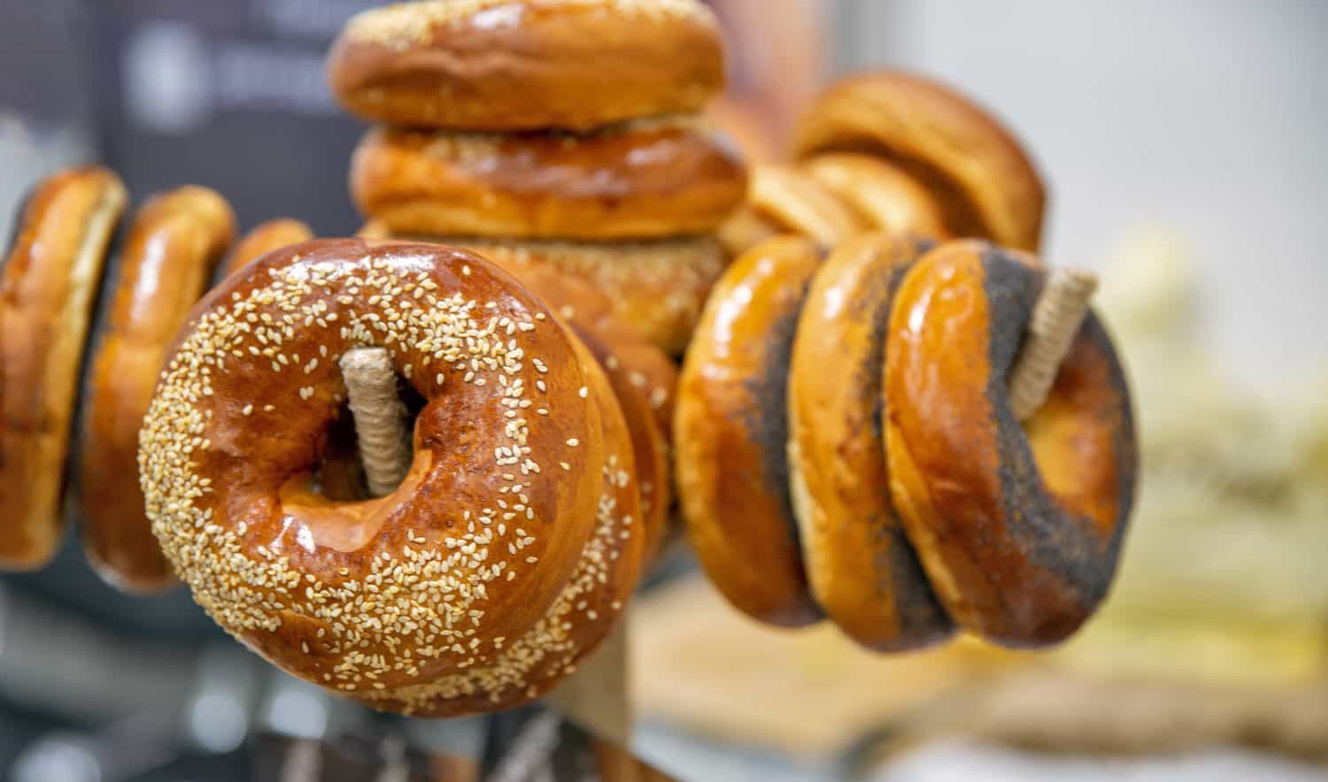 Freshly baked bagels with sesame seeds and poppy seeds closeup