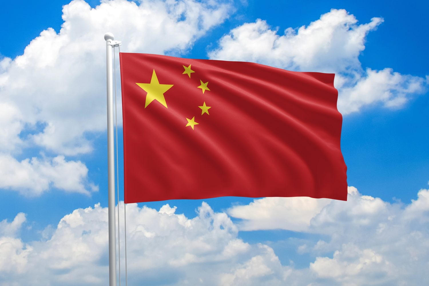 China national flag waving in the wind on clouds sky. High quality fabric. International relations concept
