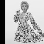 A model previews a maxi dress for 1970