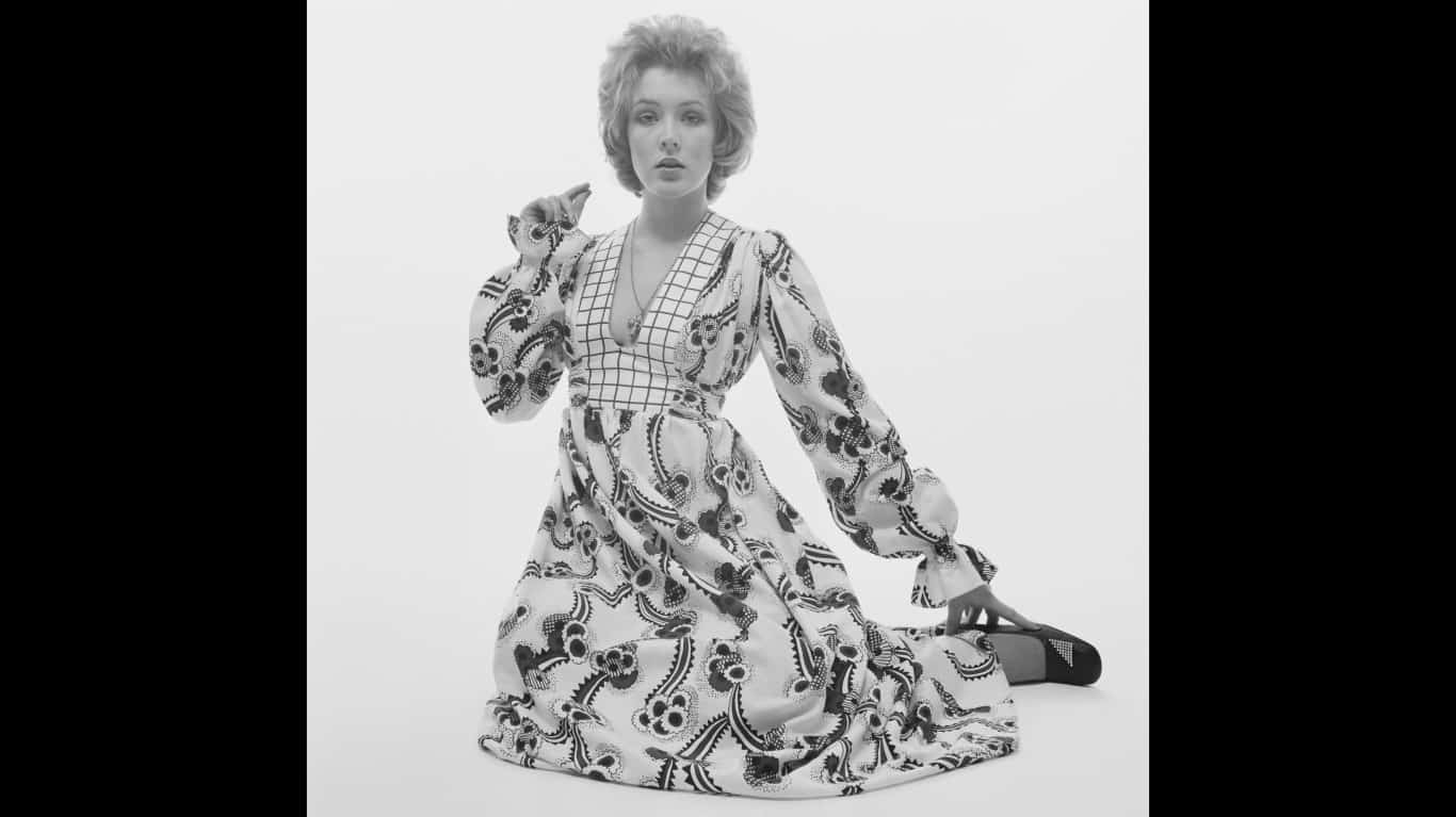 A model previews a maxi dress for 1970