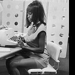 Model Lucienne poses as a glamorous secretary