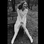 An English model in white coat and gogo boots