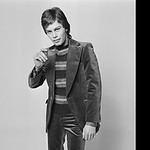 An English male model in a velvet suit