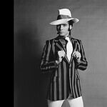 An English male model in striped blazer and fedora