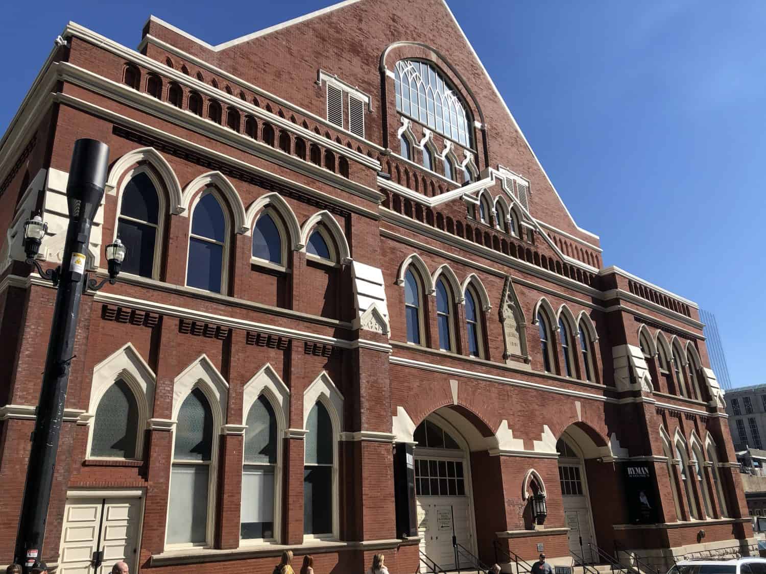 A Ryman auditorium with blue sky