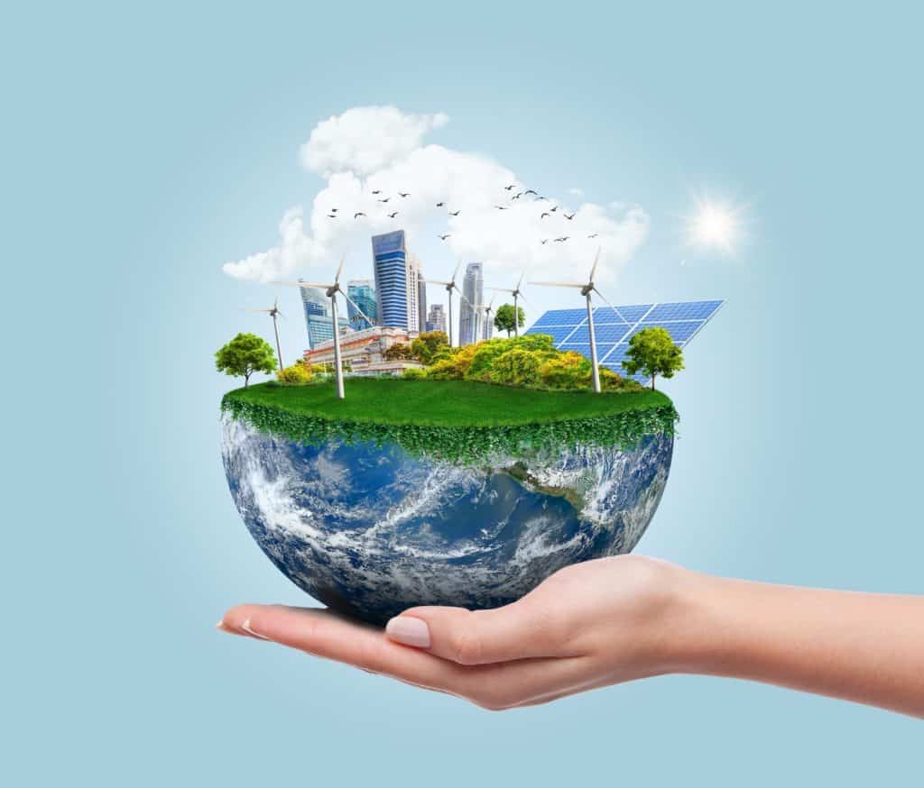 Planet earth with clean modern city relying on renewable resources. Environmental concept of alternative sustainable energy for an eco-friendly planet. Planet earth used with permission from NASA.