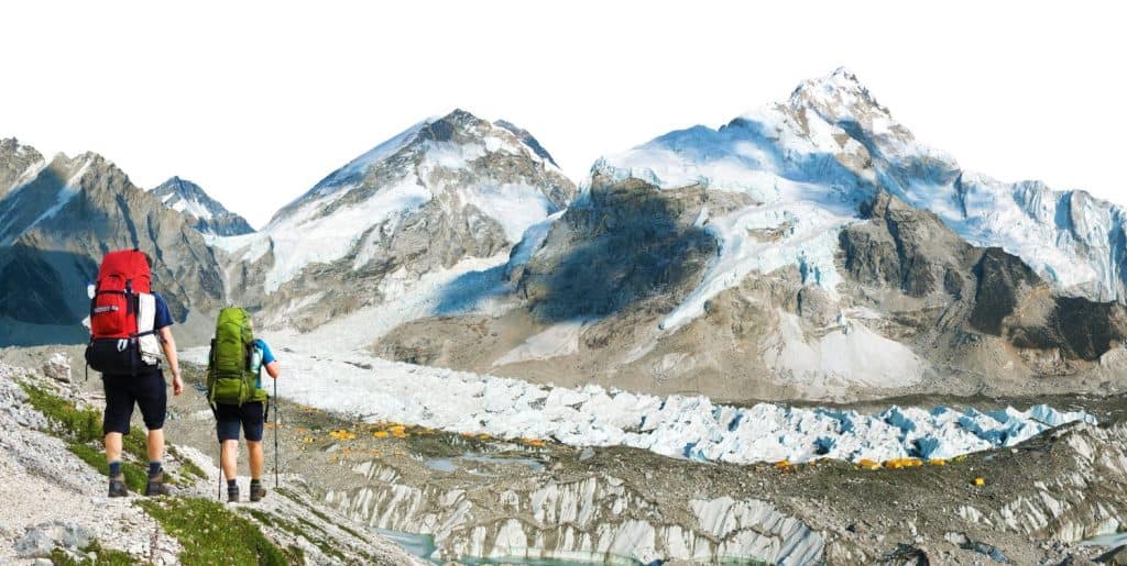 mount Everest peak and Mt Nuptse as seen from Mount Everest base camp with two hikers, climbers or mountaineers and tents on glacier, Mt Everest 8,848 m, Khumbu valley, Nepal Himalayas mountains