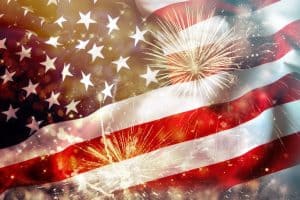 Celebrating Independence Day. United States of America USA flag with fireworks background for 4th of July
