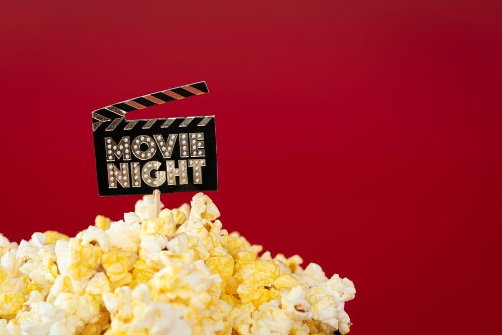 Cinema concept: delicious butter popcorn. Sign 