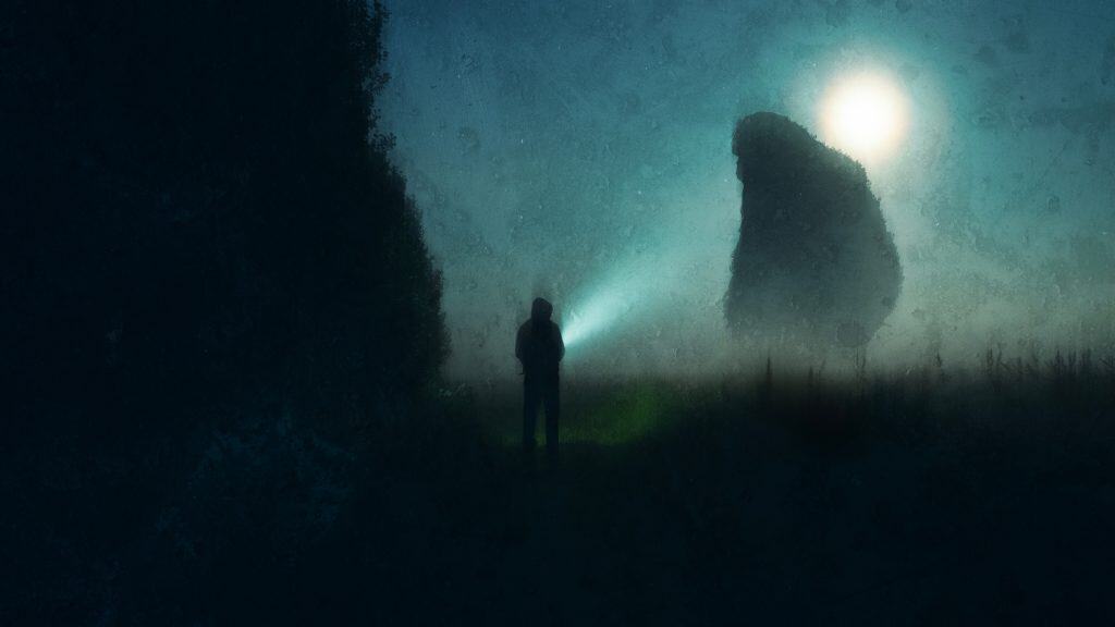 A scary giant bigfoot, silhouetted against the moon with a figure in the foregoround. On a mysterious spooky foggy night in the countryside, With a blurred, grunge edit.
