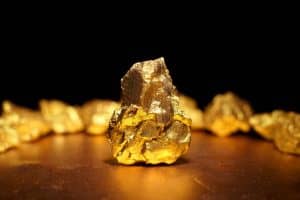 Closeup of big gold nugget finance concept