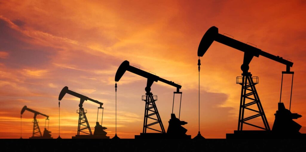 Oil pump oil rig energy industrial machine for petroleum in the sunset background for design