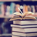 Holding Books With Arms Extended
