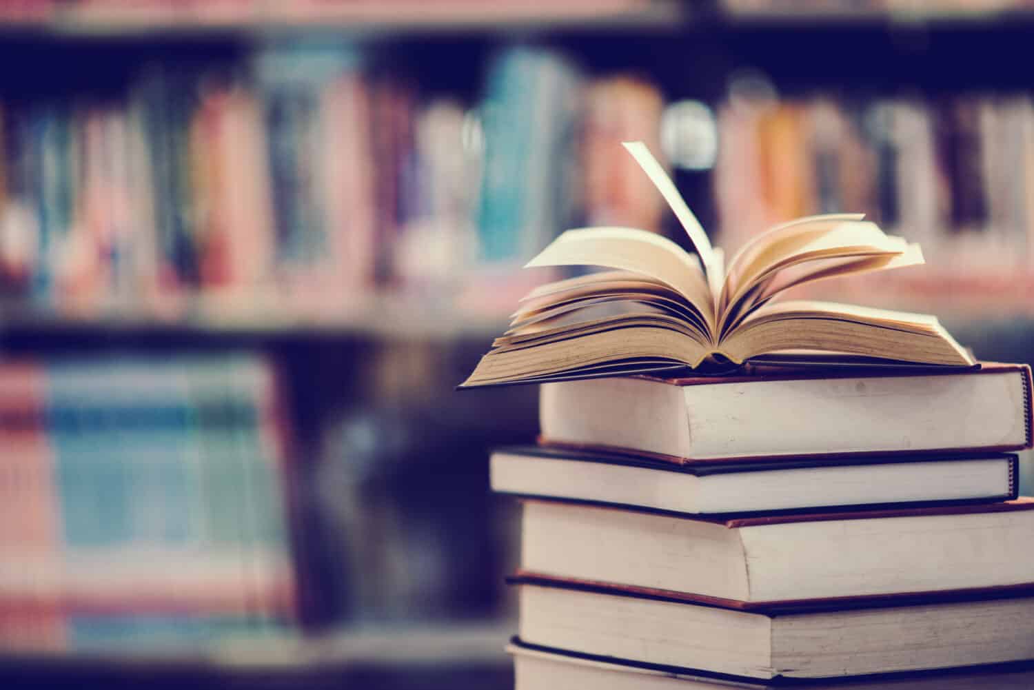 Holding Books With Arms Extended