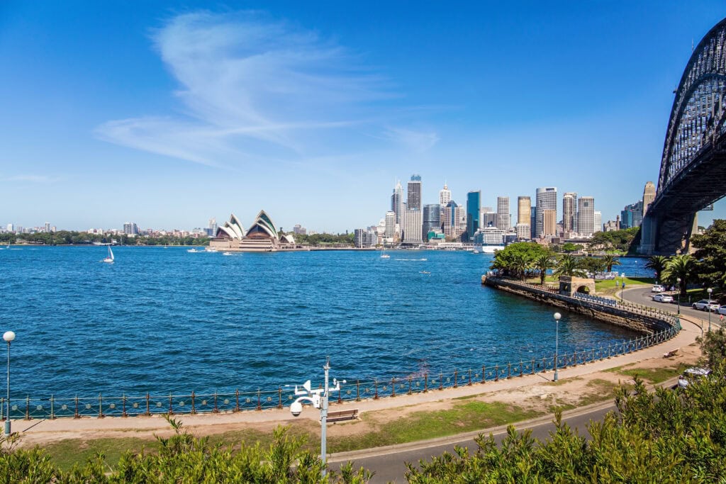 Modern skyscrapers in Sydney on the shores of the famous bay. Sidney is the largest and oldest city in Australia. Sydney seaport. Boat trip on a tourist boat 