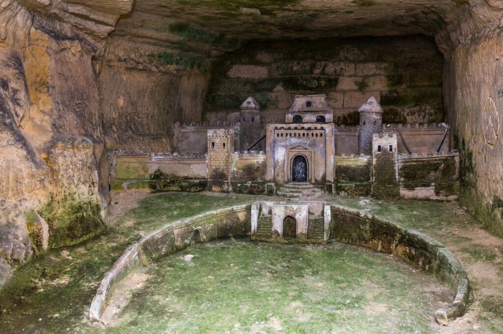 Old sculpture of a castle in the Catacomb of Paris, France