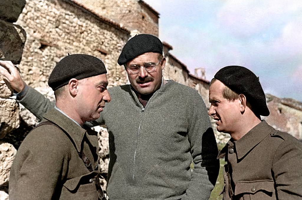 Ernest Hemingway with Soviet and German intellectuals Ilya Ehrenburg and Gustav Regler, possibly working on the propaganda film The Spanish Earth, Spain, 1937.