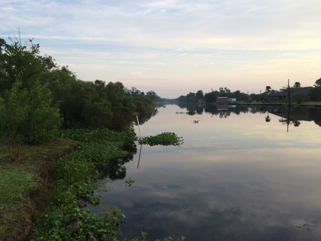 Louisiana clouds reflected in the bayou in the heart of Cajun country.
