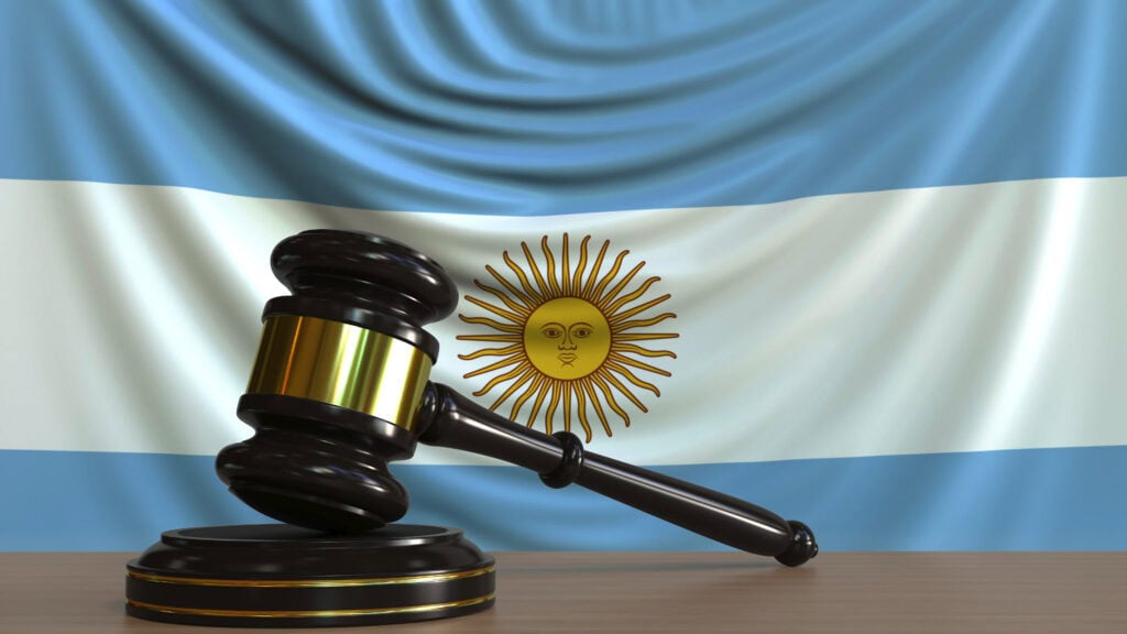 Judge's gavel and block against the flag of Argentina. Argentinian court conceptual 3D rendering