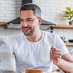 Reading the Newspaper at Breakfast