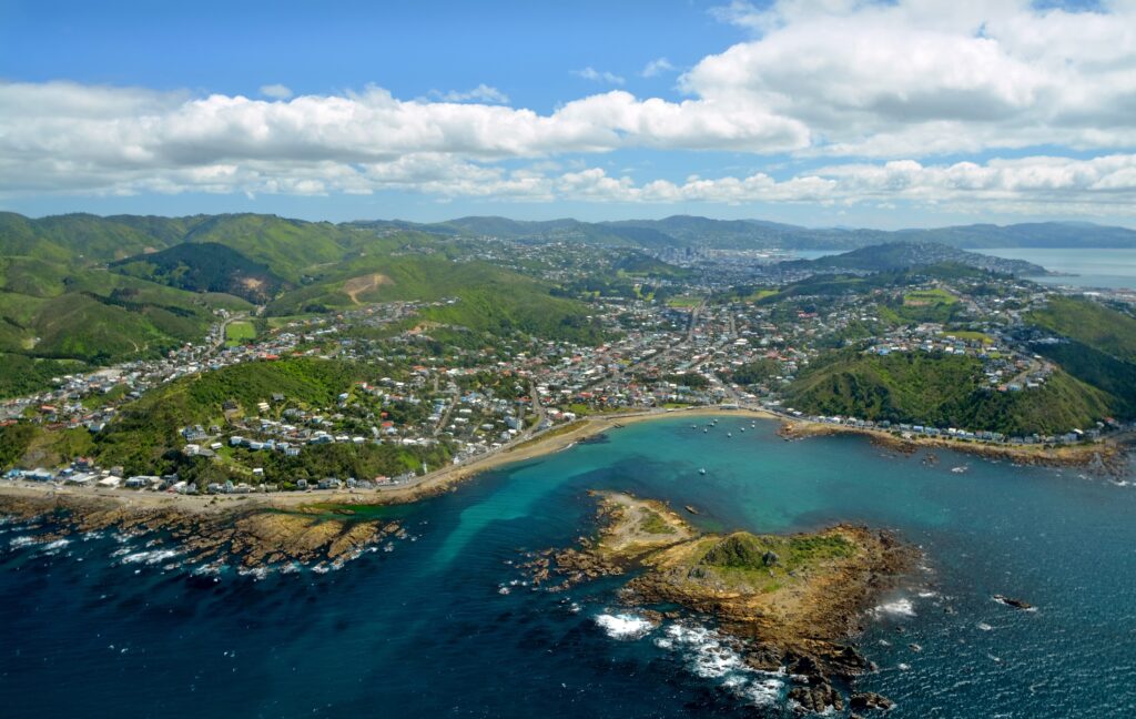 Aerial View of Wellington City from Island Bay. In the foreground are the southern suburbs with the city and harbour in the background.