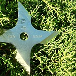 Ninja Throwing Stars Tucked Into a Laptop Sleeve