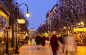 People walk along the evening busy Vitosha Boulevard in the city of Sofia, Bulgaria