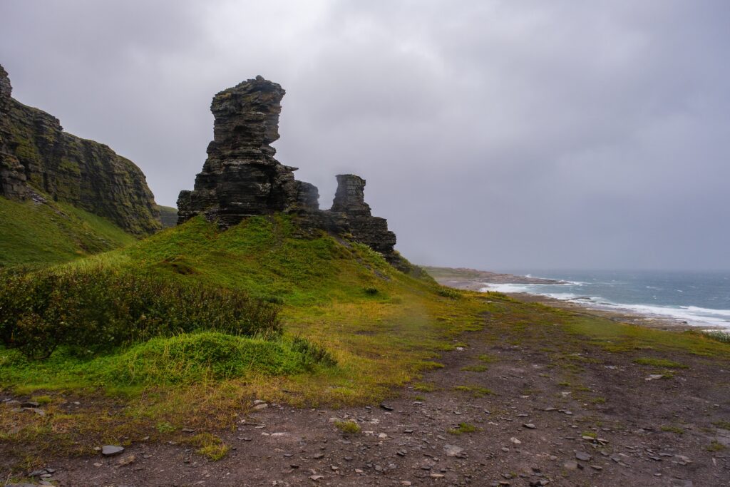 Russia, Murmansk region, Rybachy Peninsula. Barents Sea coast, "Two Brothers" rock. August 2025.