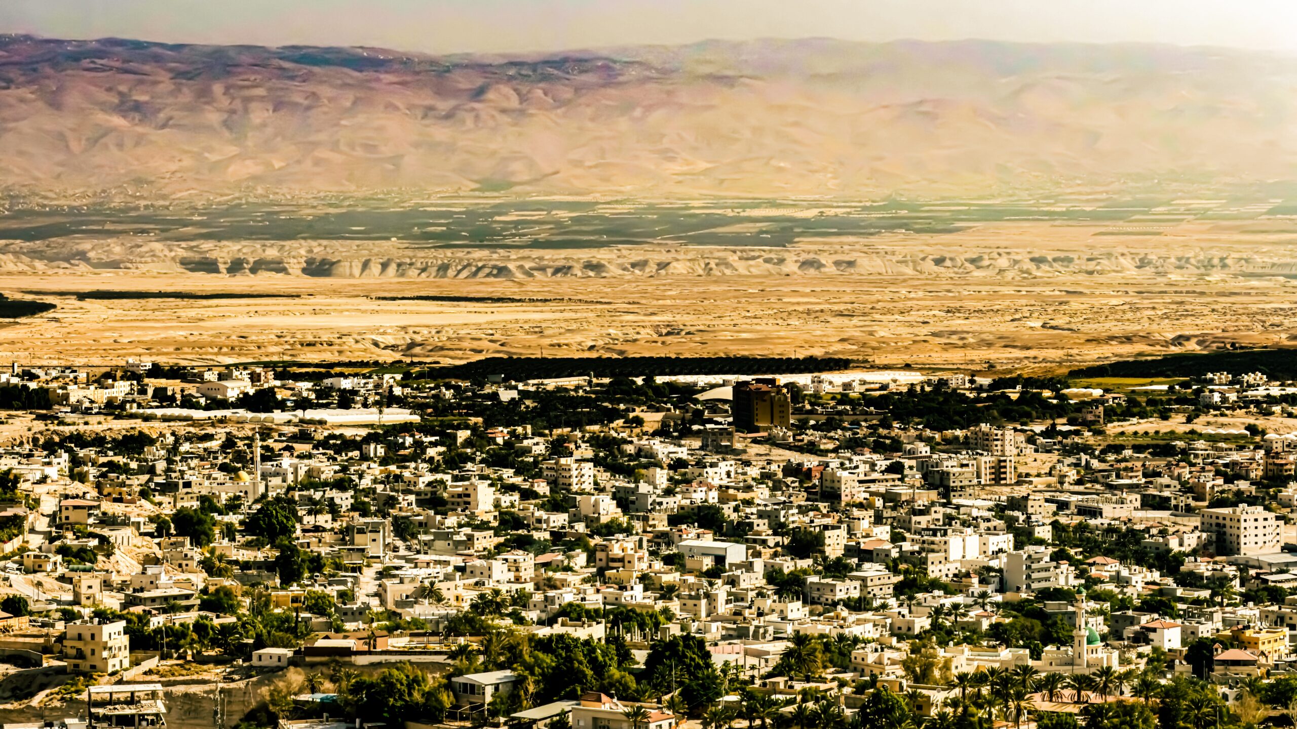 Which city's walls fell after the Israelites marched around it?