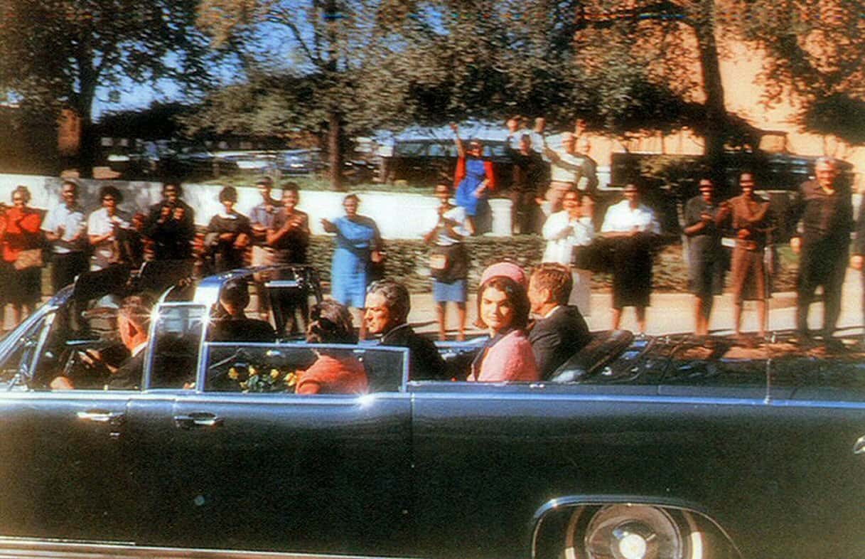 President John F. Kennedy's motorcade traveling along Elm Street in Dallas shortly before his assassination
