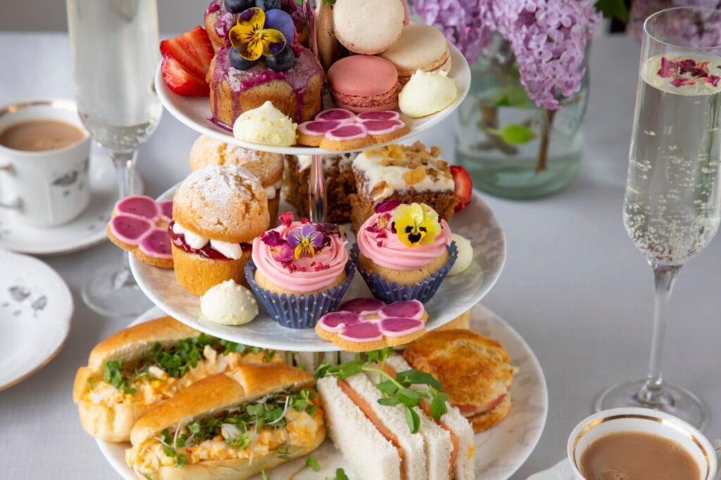 Traditional english afternoon tea with selection of cakes and sandwiches