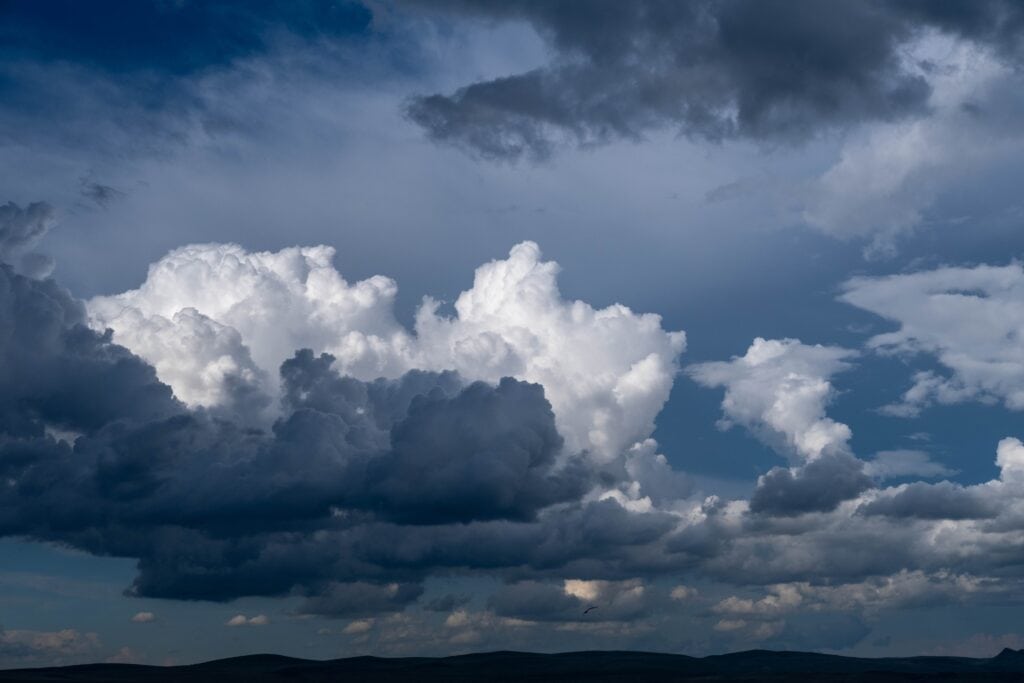Panorama of the lake before the rain. Thunderclouds over the lake. Siberia, Khakassia, Russia.