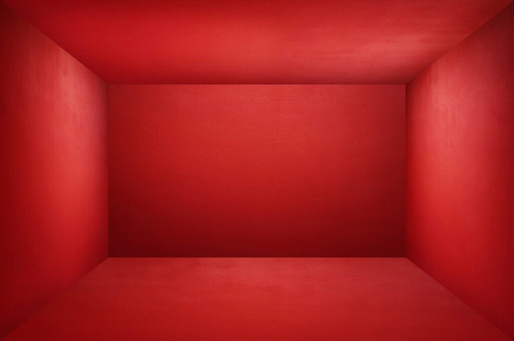 The floor and walls of the room are red as the background.